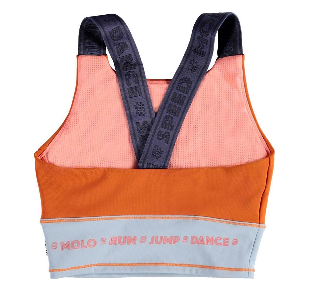 Top deportivo naranja con bloques de color -Molo